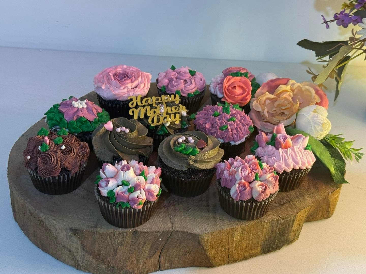 Close look at colorful piped flower cupcake decorations