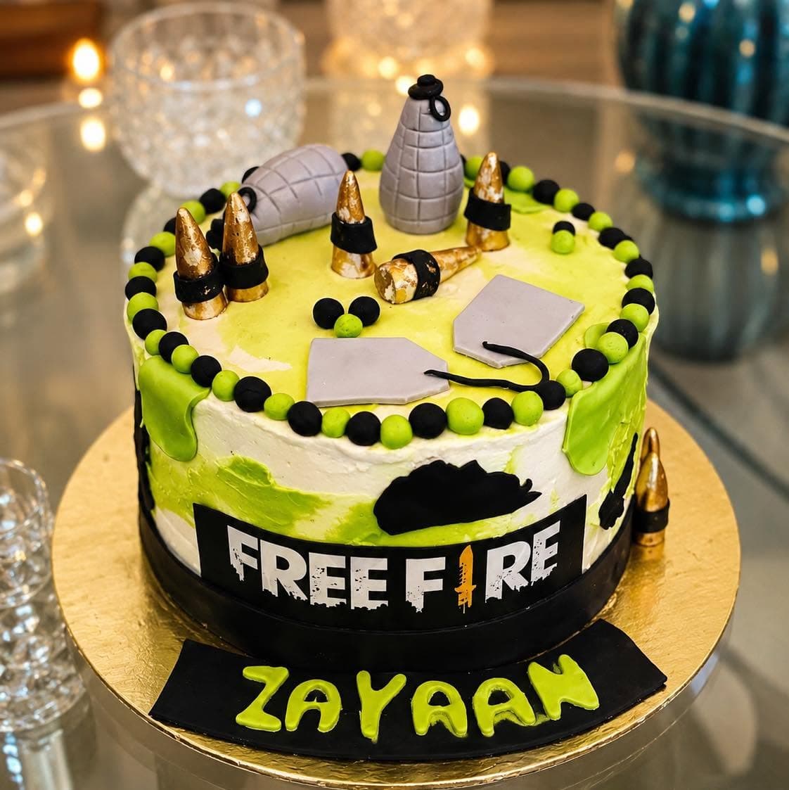 A green, yellow, and black cake with gaming-themed decorations and a printed game title.